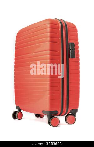 Travel red suitcase on wheels isolated on white background Stock Photo
