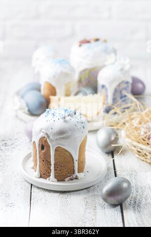 Easter table with Easter cakes and Easter eggs over white background Stock Photo