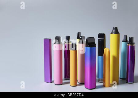 Vape e-cigarettes on a gray background with a place for text or product  advertising. Copy space Stock Photo - Alamy