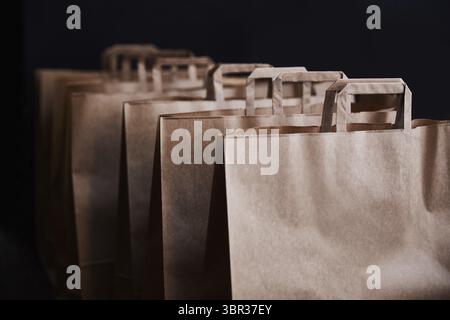 Brown paper bags on a black background Stock Photo
