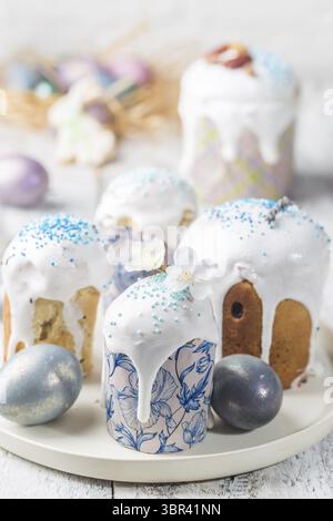 Easter table with Easter cakes and Easter eggs over white background Stock Photo