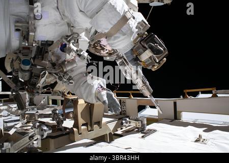 July 1, 2020 - Earth's Atmosphere - NASA astronaut and Expedition 63 Flight Engineer Bob Behnken works during a six-hour and one-minute spacewalk to swap an aging nickel-hydrogen battery for a new lithium-ion battery on the International Space Station's Starboard-6 truss structure. Behnken is pictured holding a pistol grip tool he used to remove and attach bolts that hold the batteries in place. (Credit Image: © NASA/ZUMA Wire/ZUMAPRESS.com) Stock Photo