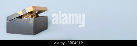 A red cat is hiding in a box. Copy space Stock Photo