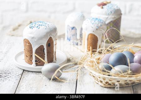 Easter table with Easter cakes and Easter eggs over white background Stock Photo