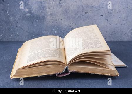 Open book on dark background with copy space Stock Photo
