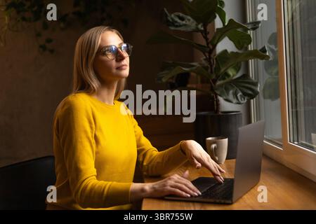 woman in a sweatshirt was thinking about something pleasant Stock Photo