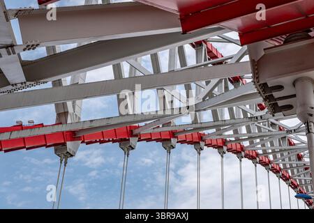 steel beams is bolted down. Close-up shows the connection of the metal ...