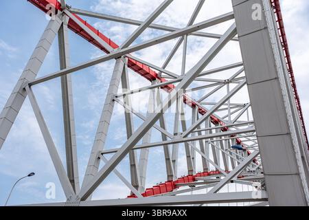 steel beams is bolted down. Close-up shows the connection of the metal ...