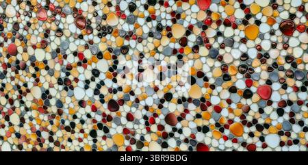 Wall decorated with colorful stone Stock Photo