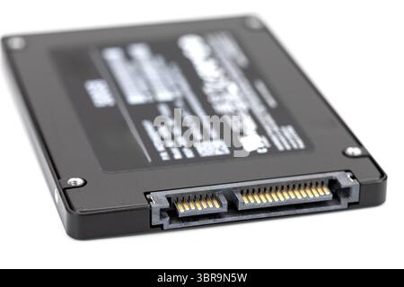 A close up image of black solid state drive ssd showcasing its connector pins and sleek design, highlighting modern technology used for data storage Stock Photo