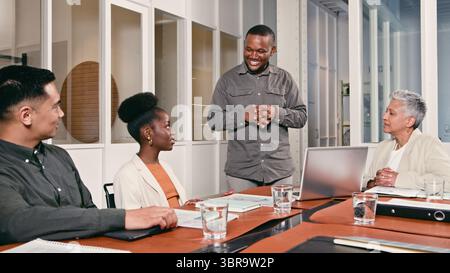 Business Professionals Engaging in a Collaborative Team Meeting in a Modern Office Environment Stock Photo