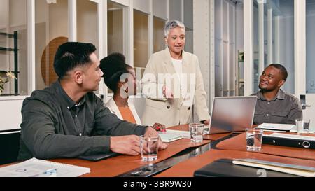 Diverse Team in a Modern Office Collaborating During a Business Meeting Stock Photo