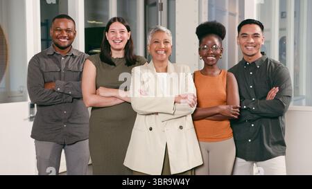 Diverse Group of Professionals Smiling Confidently in a Modern Office Environment Stock Photo