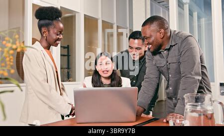 Diverse Team Collaborating Together and Engaging in a Productive Office Discussion Stock Photo