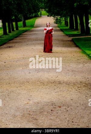 Woman with long red hair walks in weird forest . Ethereal and romantic ...