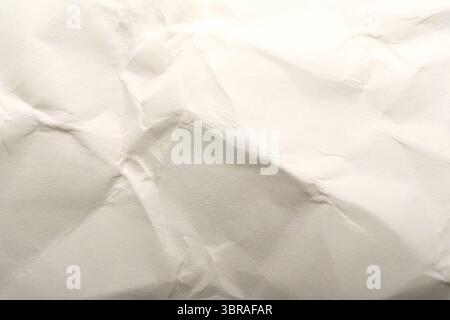 Crumpled white paper reveals beautiful textures and patterns. Stock Photo