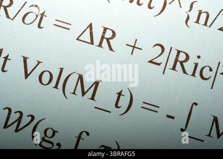 Complex equations illustrate advanced concepts in theoretical physics. Stock Photo
