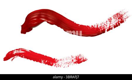Bold red paint lines intertwine, showcasing artistic expression and color. Stock Photo