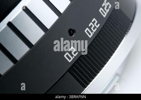 Detailed view of aperture settings on a camera lens showing precise adjustments. Stock Photo