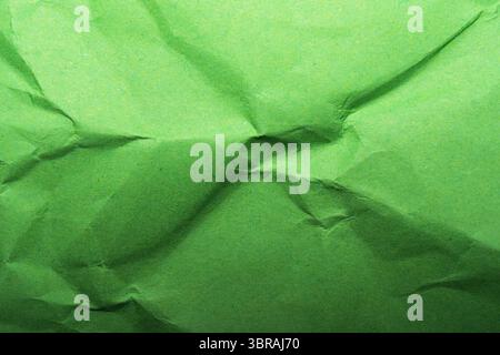 A vibrant, crumpled green surface invites tactile exploration and creativity. Stock Photo