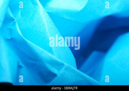 Unique shades of blue paper intertwined, creating an artistic texture. Stock Photo