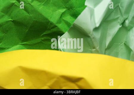 Colorful crumpled paper forms a textured, inviting composition. Stock Photo
