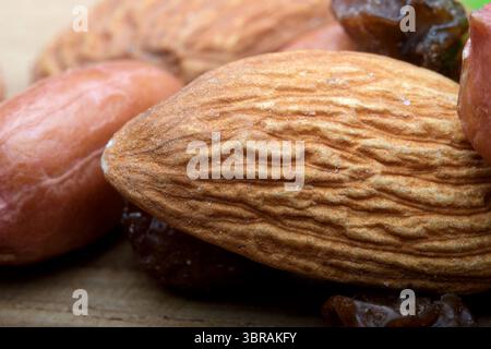 Close-up of a variety of nuts and dried fruits showcasing textures and colors. Stock Photo