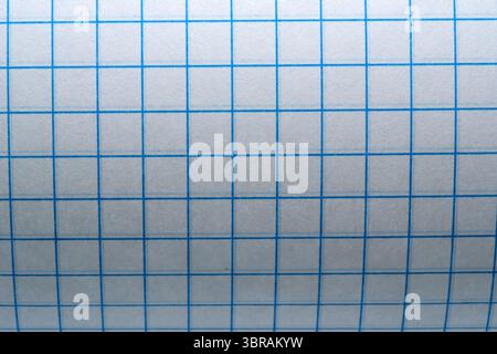 Blank grid paper awaits inspiration for artistic creations and notes. Stock Photo