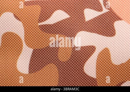A textured surface features a blend of brown and beige shapes, creating depth. Stock Photo