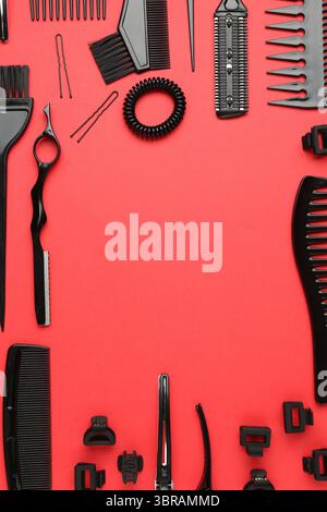 Frame of different hairdresser's tools on red background, flat lay. Space for text Stock Photo