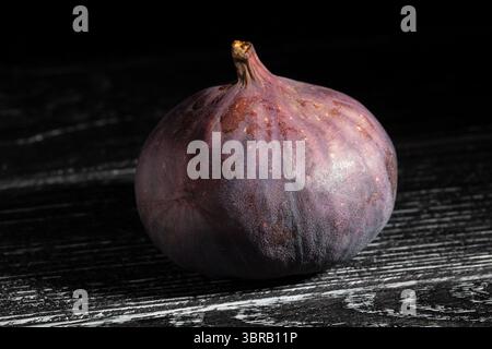 figs fruit on black wood background Stock Photo