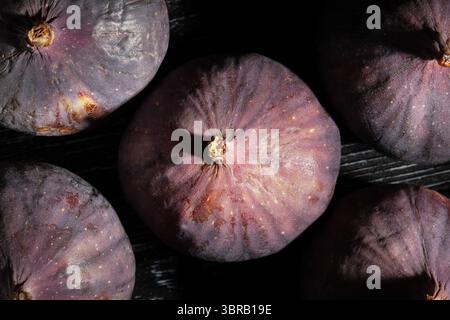 figs fruit on black wood background top view Stock Photo