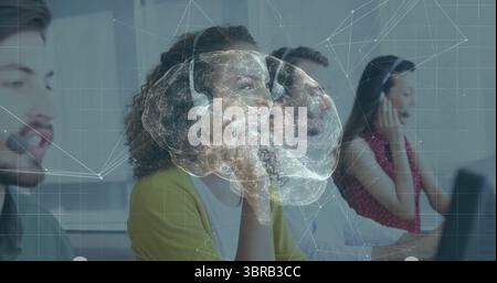 Talking agent in yellow cardigan speaking into headset at call center, with digital brain overlay Stock Photo