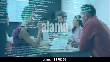 Software development team reviewing code in office, with laptops, notebooks and projected code Stock Photo