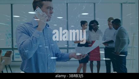 Man talking on smartphone, holding document in office, with binder, stack of papers, copy space Stock Photo