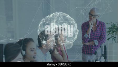 Projecting holographic brain network hovering above call center agents at office, with headsets Stock Photo