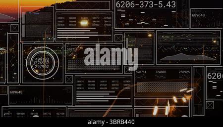 Displaying translucent dashboard panels showing line graphs and waveforms over night city lights Stock Photo