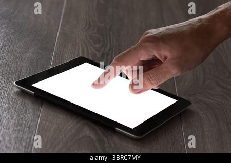 hand presses on screen digital tablet Stock Photo