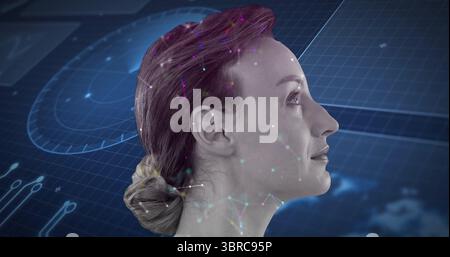 Displaying mid-adult woman head in right-profile on virtual interface background, with data dials Stock Photo