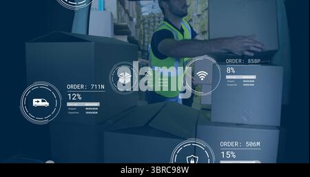 Handling warehouse worker placing cardboard box on stack in warehouse, with digital overlay icons Stock Photo