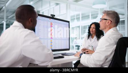Medical Billing Audit By Doctors Using Spreadsheet For Hospital Bill Analysis. Stock Photo