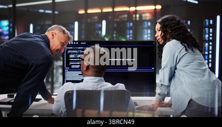 Agile Professionals Collaborate On Programming Efficiency In Diverse Team Setting. Stock Photo