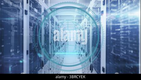 Displaying teal overlay monitoring network inside data center, with server racks and blinking LEDs Stock Photo