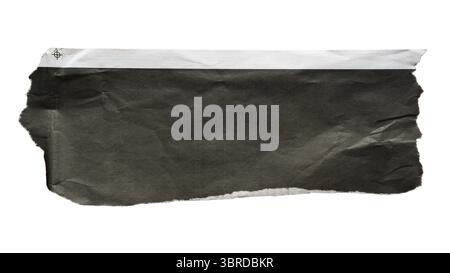 A piece of torn black newspaper suitable for use as a text box background on white background with clipping path Stock Photo