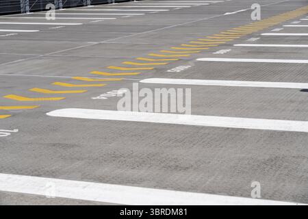 Markings on a car park deck, Direction of travel marking, Numbered parking spaces, Graphic Stock Photo