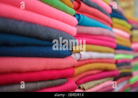 Vibrant stacks of Turkish fabrics in a textile shop, showcasing colorful traditional cloth and woven textures Stock Photo