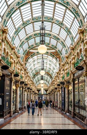 Interior view of County Arcade, a richly decorated Victorian shopping arcade with glass domes, pink marble columns and luxury stores in Leeds, UK Stock Photo
