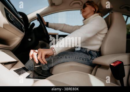 Woman Shifting Gears in a Car Stock Photo