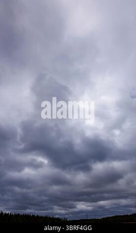 Gray rain clouds covering the sky , Finland Stock Photo