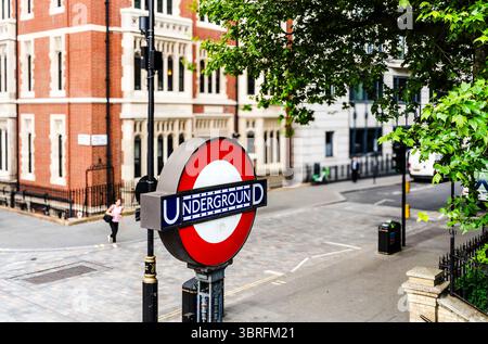 Classic red and blue roundel of the London Underground at Temple station, an iconic metro sign and symbol of the city's transport system, London, UK Stock Photo